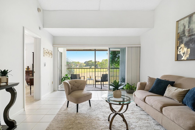 living room featuring light tile patterned floors and baseboards