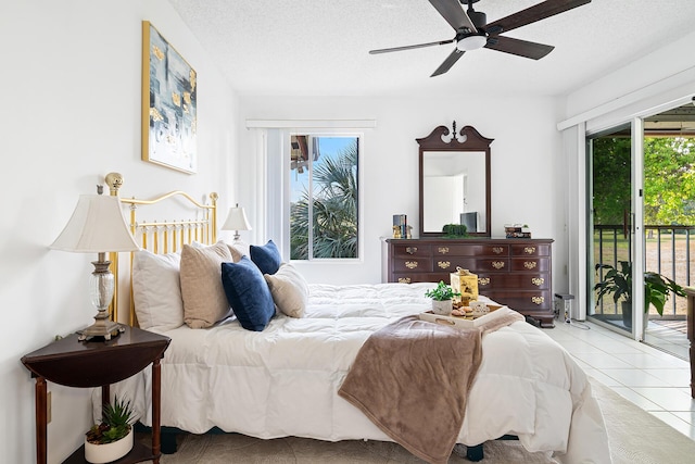 tiled bedroom featuring access to outside, ceiling fan, and a textured ceiling