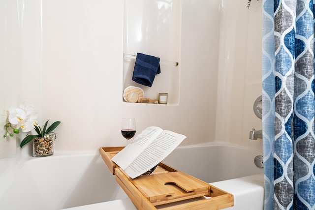 bathroom with a tub and a shower with curtain