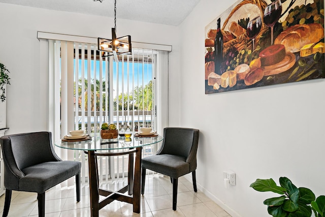 living area featuring a chandelier, baseboards, and tile patterned floors