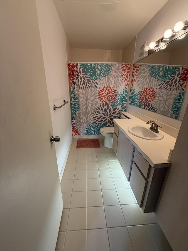 full bath with vanity, tile patterned floors, toilet, and a shower with curtain