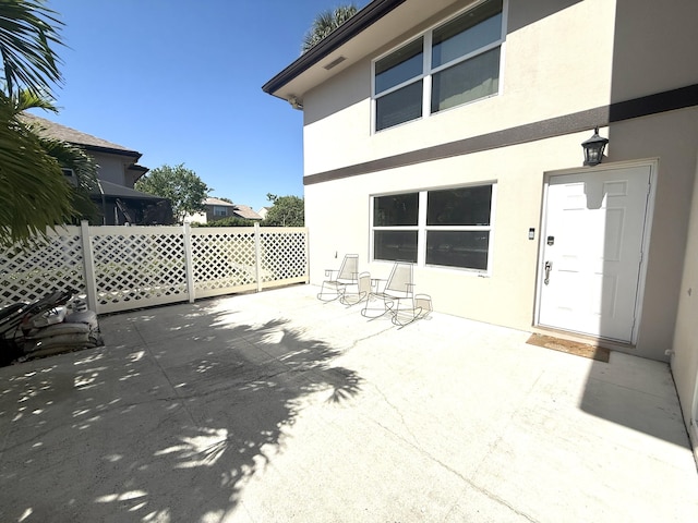 view of patio / terrace featuring fence