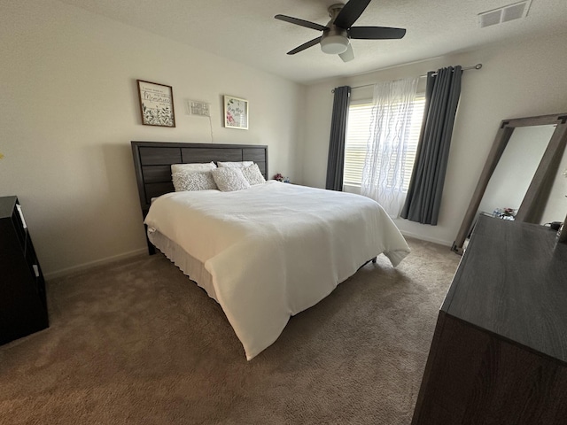 bedroom with a ceiling fan, visible vents, carpet, and baseboards