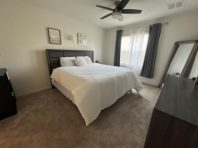 bedroom featuring baseboards, visible vents, ceiling fan, and carpet flooring