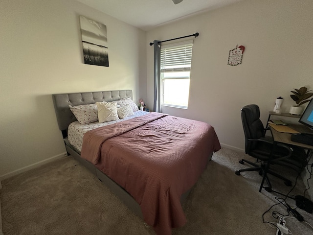 bedroom featuring carpet flooring and baseboards