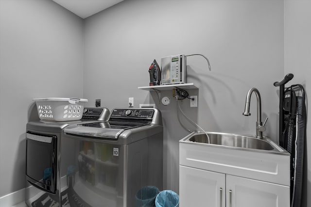 10786 Greenbriar Villa Dr, Lake Worth, FL 33449 - laundry area with cabinet space, a sink, and washing machine and clothes dryer