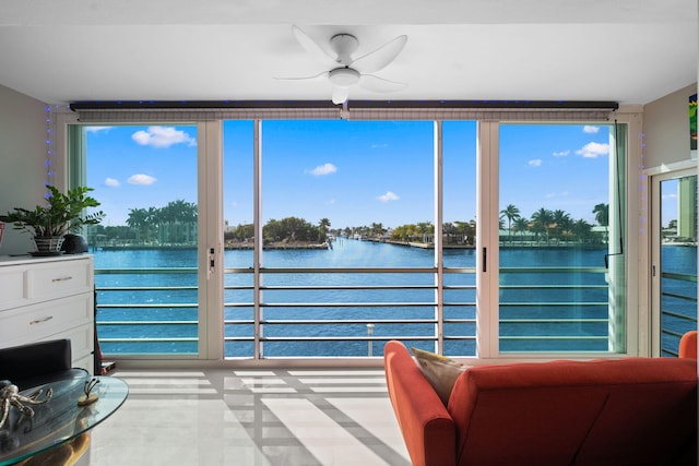 sunroom / solarium with a water view and plenty of natural light