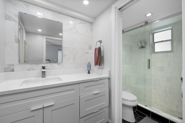 full bath featuring toilet, recessed lighting, vanity, tile walls, and a shower stall