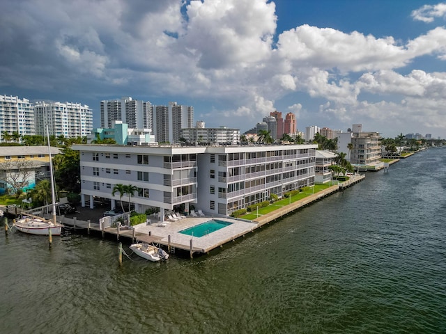 exterior space featuring a view of city and a water view