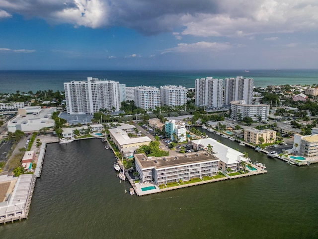 bird's eye view featuring a water view and a city view