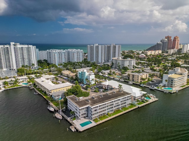 aerial view featuring a view of city and a water view