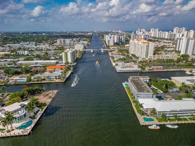 birds eye view of property with a view of city and a water view