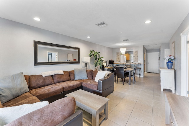 living area with recessed lighting, visible vents, and light tile patterned flooring