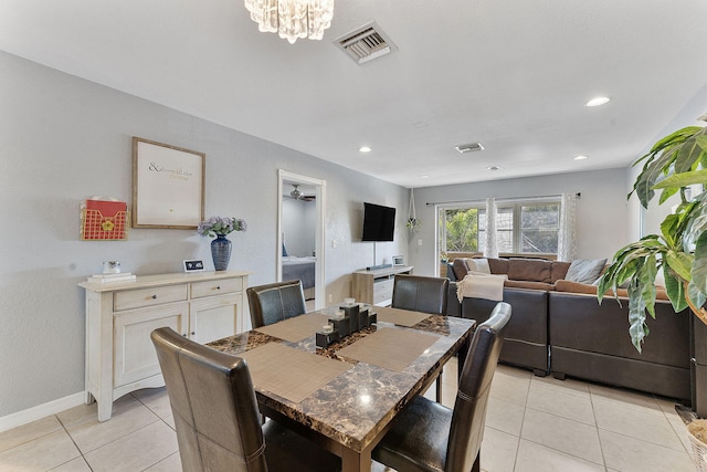 dining area with light tile patterned floors, a chandelier, recessed lighting, visible vents, and baseboards