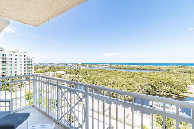 balcony featuring a water view