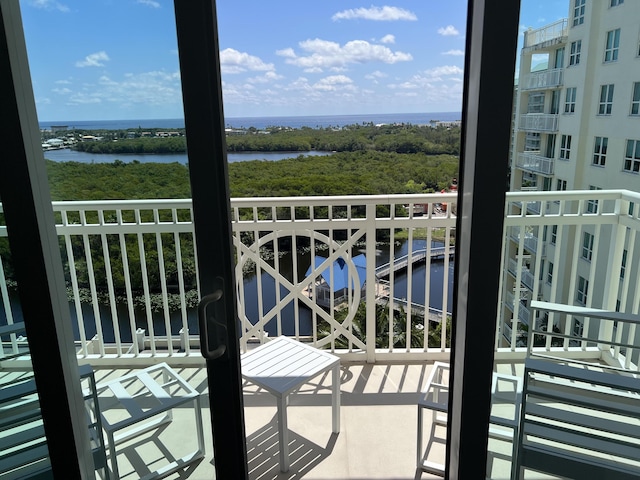 balcony featuring a water view