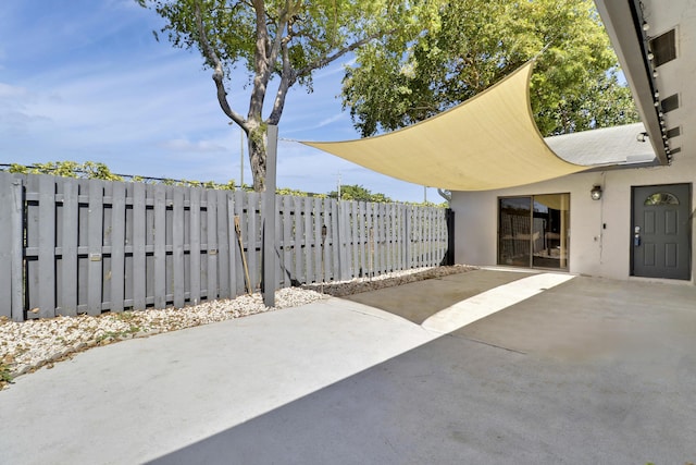 view of patio featuring fence