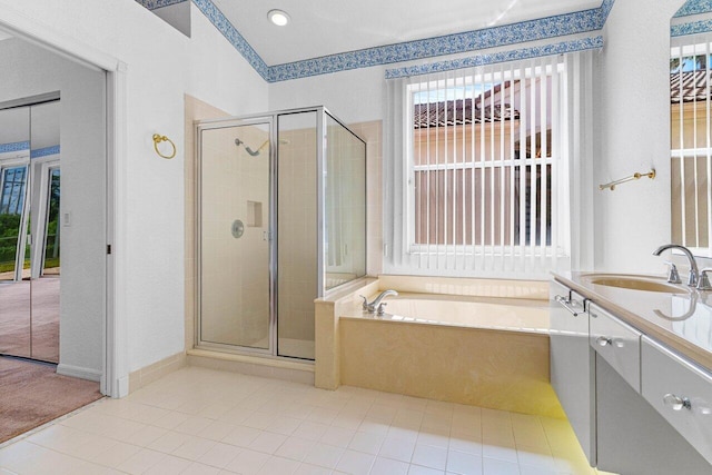 full bathroom with a wealth of natural light, a stall shower, vanity, and a bath