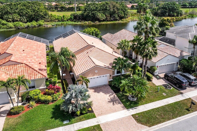 birds eye view of property with a water view