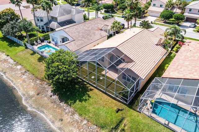 bird's eye view featuring a water view and a residential view