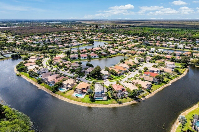 birds eye view of property featuring a water view and a residential view