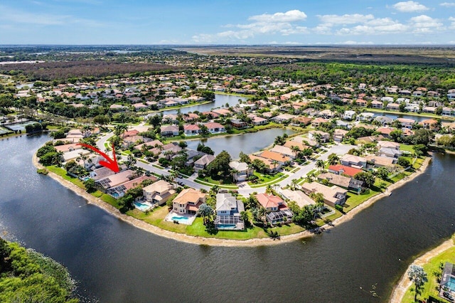 bird's eye view featuring a water view and a residential view