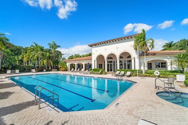 community pool featuring a patio area