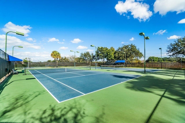 view of sport court with fence