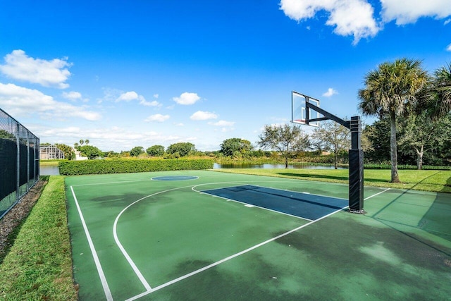 view of sport court with a water view and community basketball court