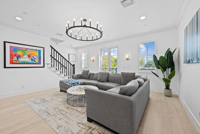 living area featuring visible vents, wood finished floors, stairs, crown molding, and french doors