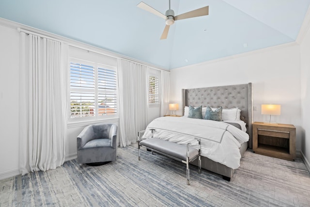 bedroom with ceiling fan, high vaulted ceiling, and baseboards