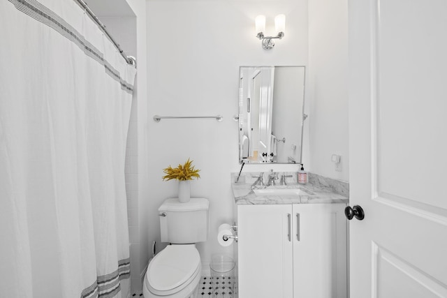 bathroom with curtained shower, vanity, and toilet