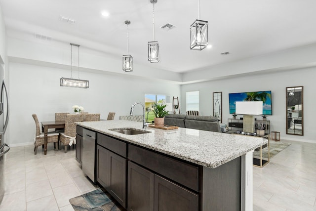 kitchen featuring pendant lighting, visible vents, a sink, dark brown cabinetry, and dishwasher