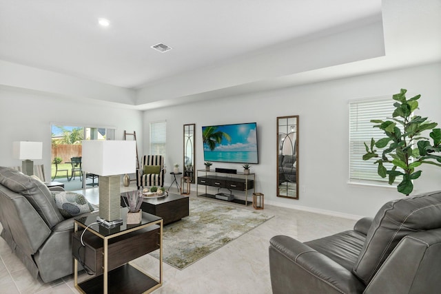 living room featuring visible vents and baseboards