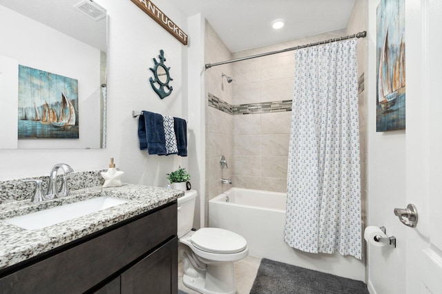 bathroom featuring toilet, shower / bath combo, visible vents, and vanity