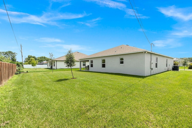 view of yard with fence and cooling unit