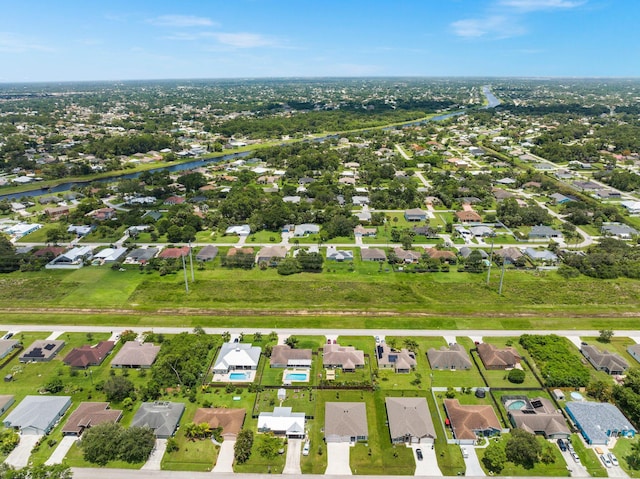 birds eye view of property with a residential view