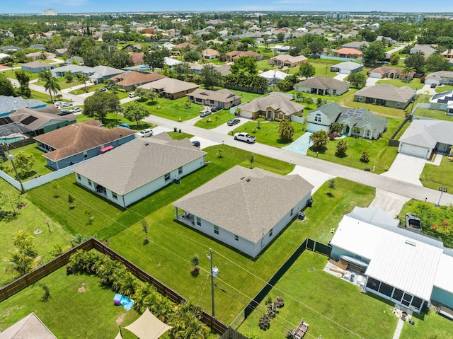 birds eye view of property with a residential view