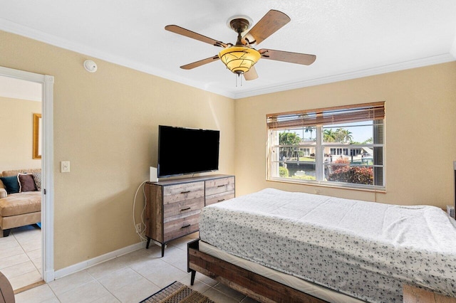 bedroom with light tile patterned flooring, a ceiling fan, baseboards, and ornamental molding