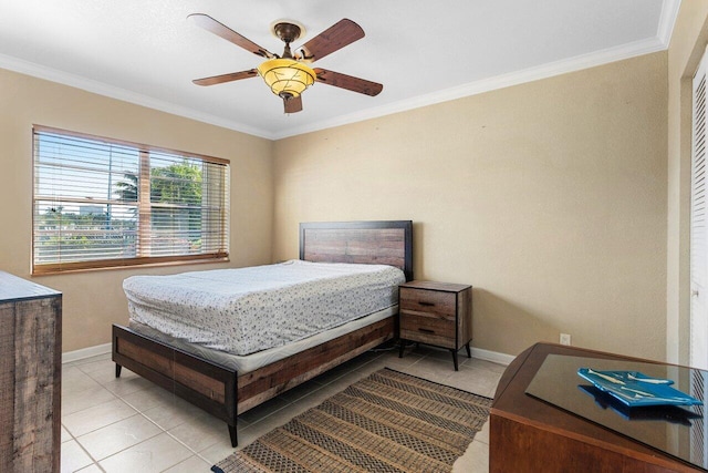 bedroom featuring light tile patterned floors, baseboards, ceiling fan, and crown molding