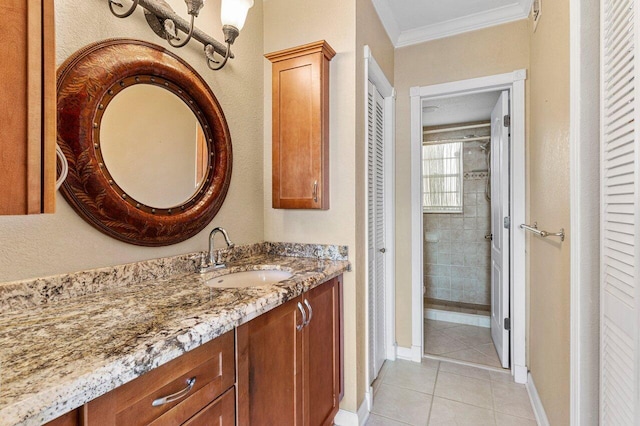 full bathroom with tile patterned floors, a closet, crown molding, baseboards, and vanity