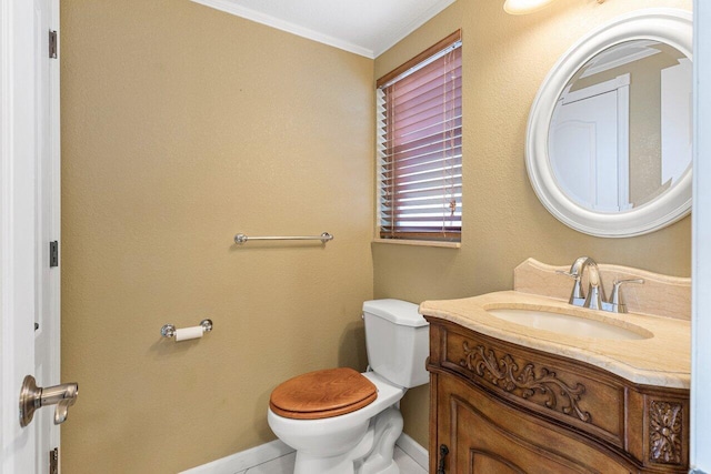 half bath featuring baseboards, toilet, ornamental molding, and vanity