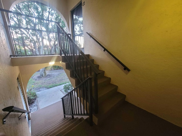 stairs with a textured wall