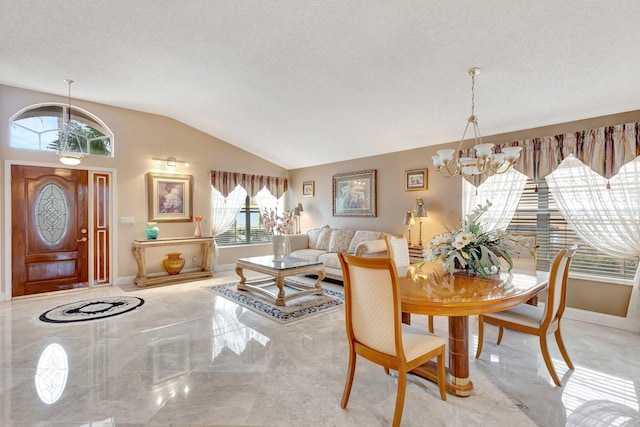 dining room with marble finish floor, vaulted ceiling, a textured ceiling, and an inviting chandelier