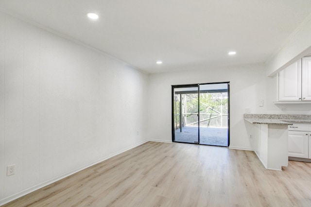 interior space with recessed lighting, baseboards, and light wood finished floors