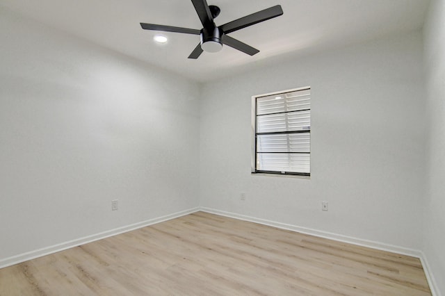 unfurnished room featuring light wood-type flooring, ceiling fan, and baseboards