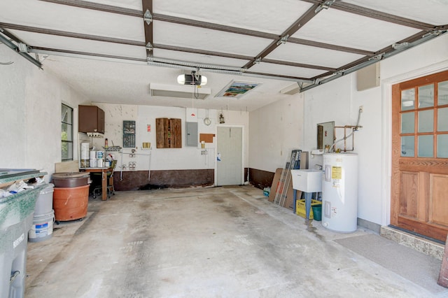 garage featuring a garage door opener, electric panel, and electric water heater