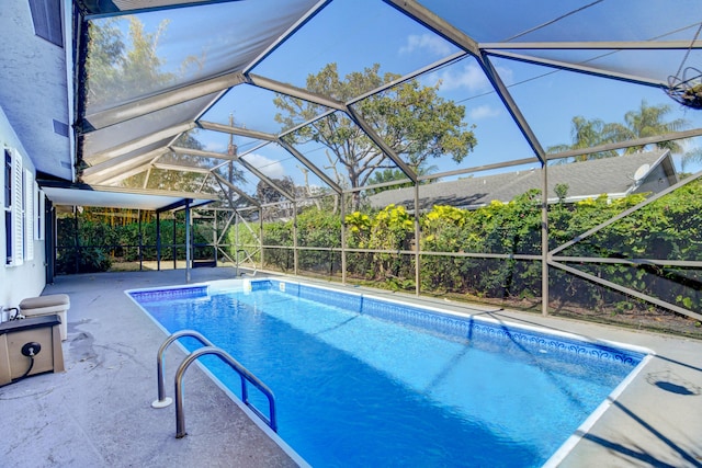 pool with a patio and a lanai