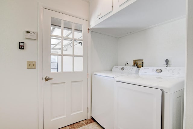 clothes washing area featuring washing machine and clothes dryer