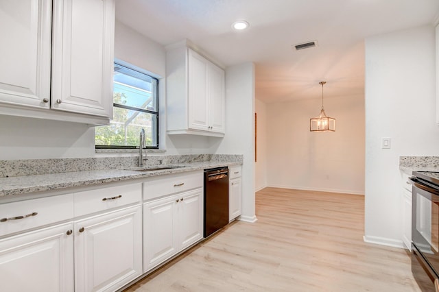 kitchen with visible vents, light wood-style floors, black appliances, white cabinetry, and a sink